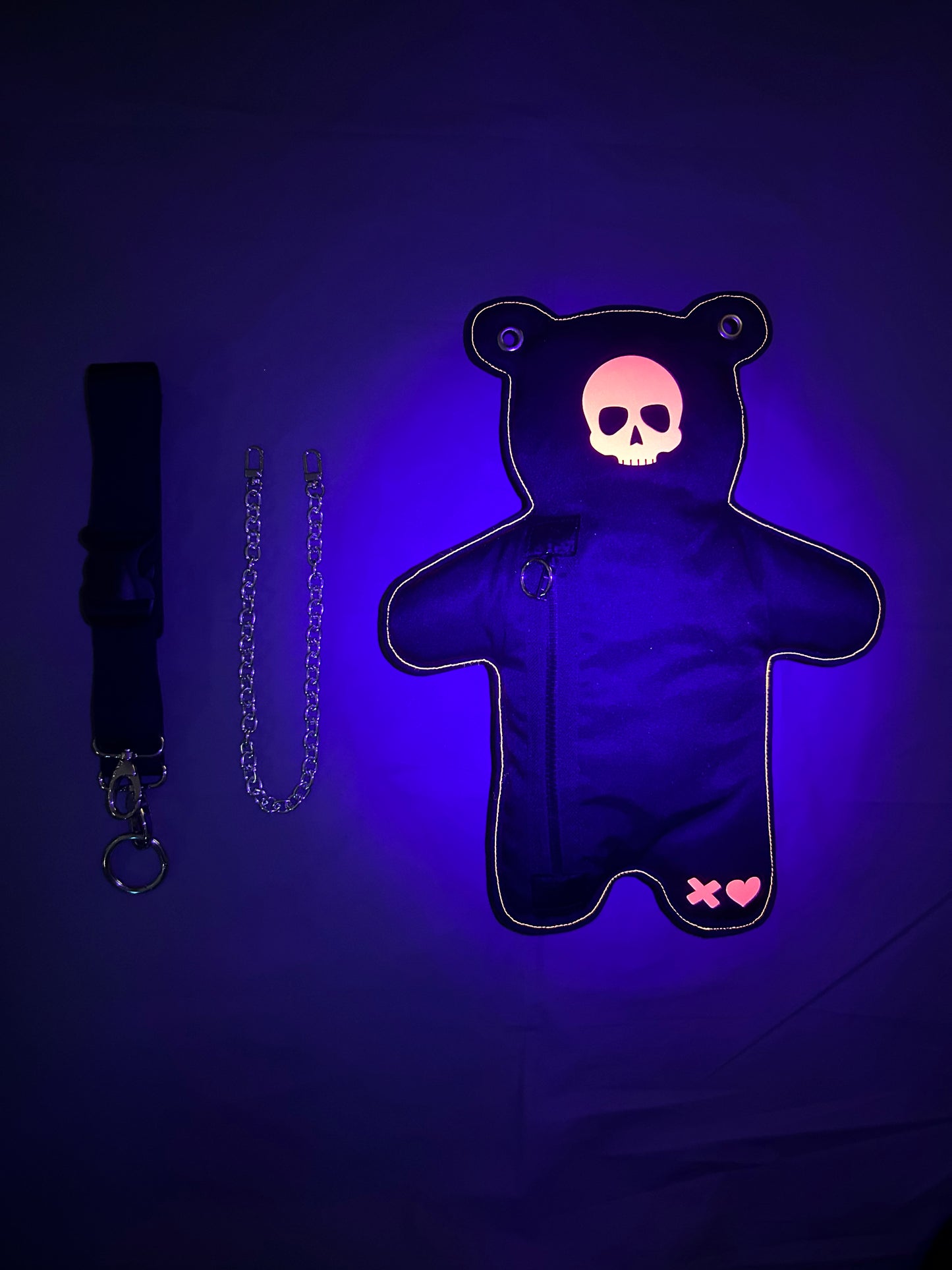Featuring a bold black exterior and fluorescent and reflective skull print, it captures light and radiates glow under UV light.