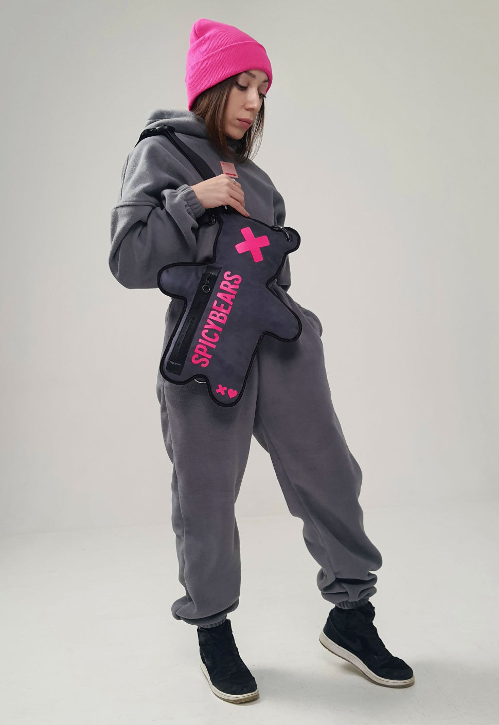 Add a pop of color to your look with our Gray Faux Suede SPICYBEARS crossbody bear bag featuring a playful neon pink color print