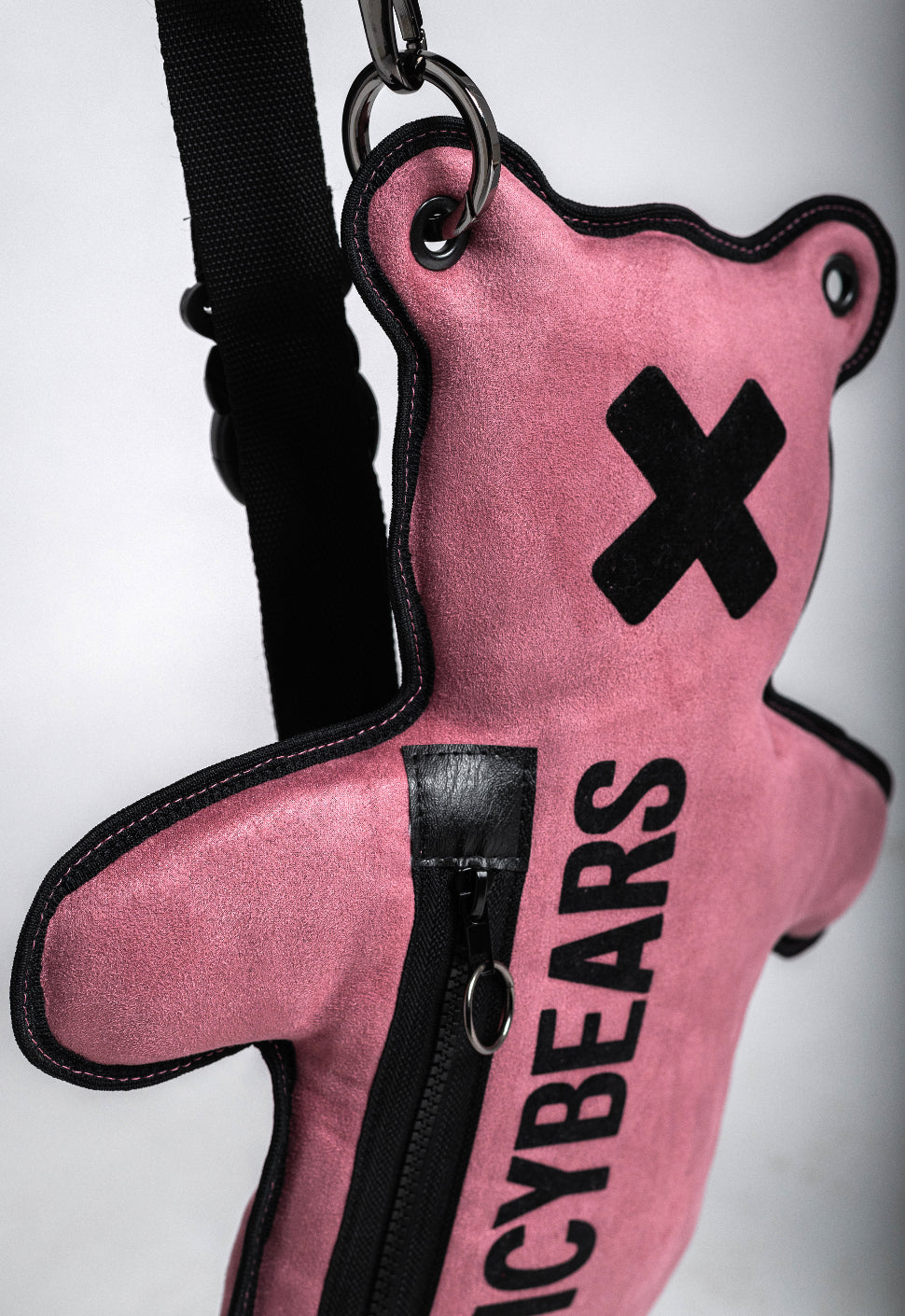 The perfect streetwear accessory - a huggable bear-shaped crossbody bag in dusty rose faux suede with black velvet print by SPICYBEARS