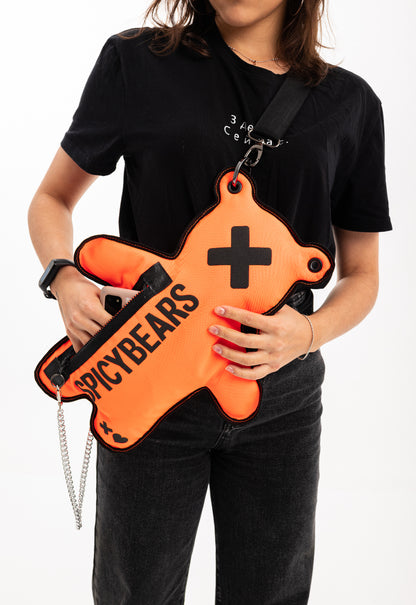 A person wearing the Neon Orange SPICYBEARS Bag, showing off the roomy pockets and adjustable strap for comfortable wear