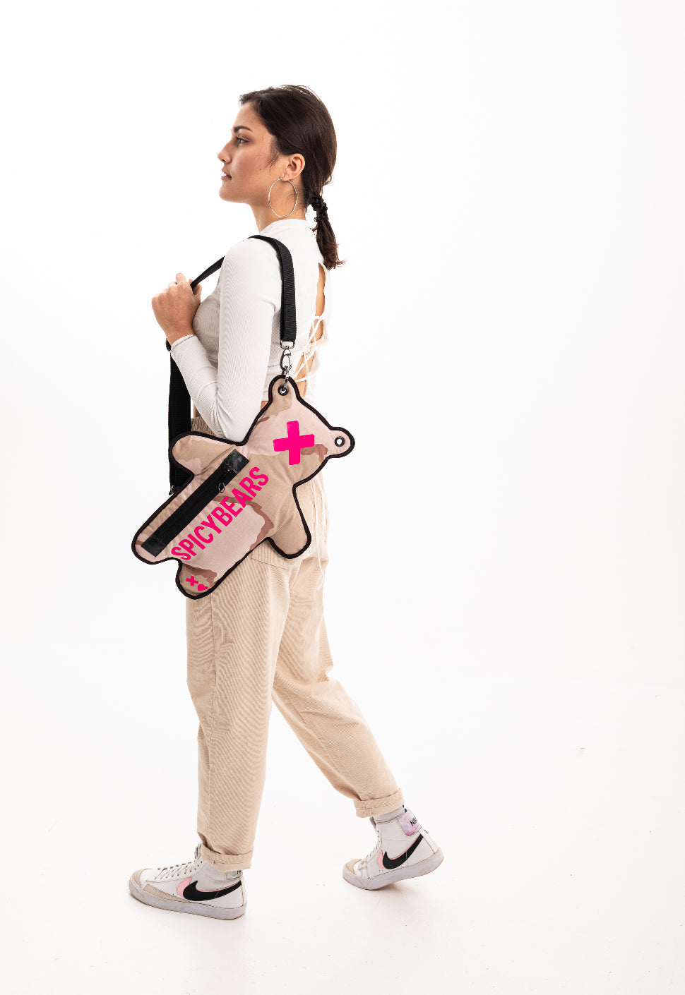 Add a pop of color to your streetwear look with this Sandy SPICYBEARS Bag With Neon Pink Print